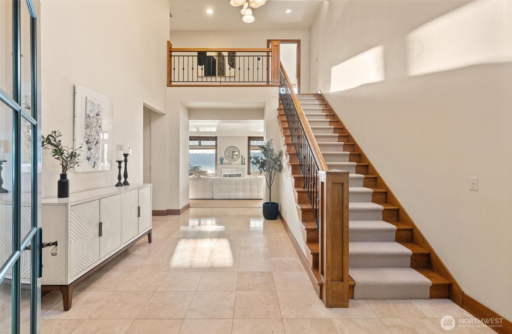 8281 West Mercer Way Mercer Island, WA 98040 - Photo 20 of 38 a hallway with white doors wooden floor and windows