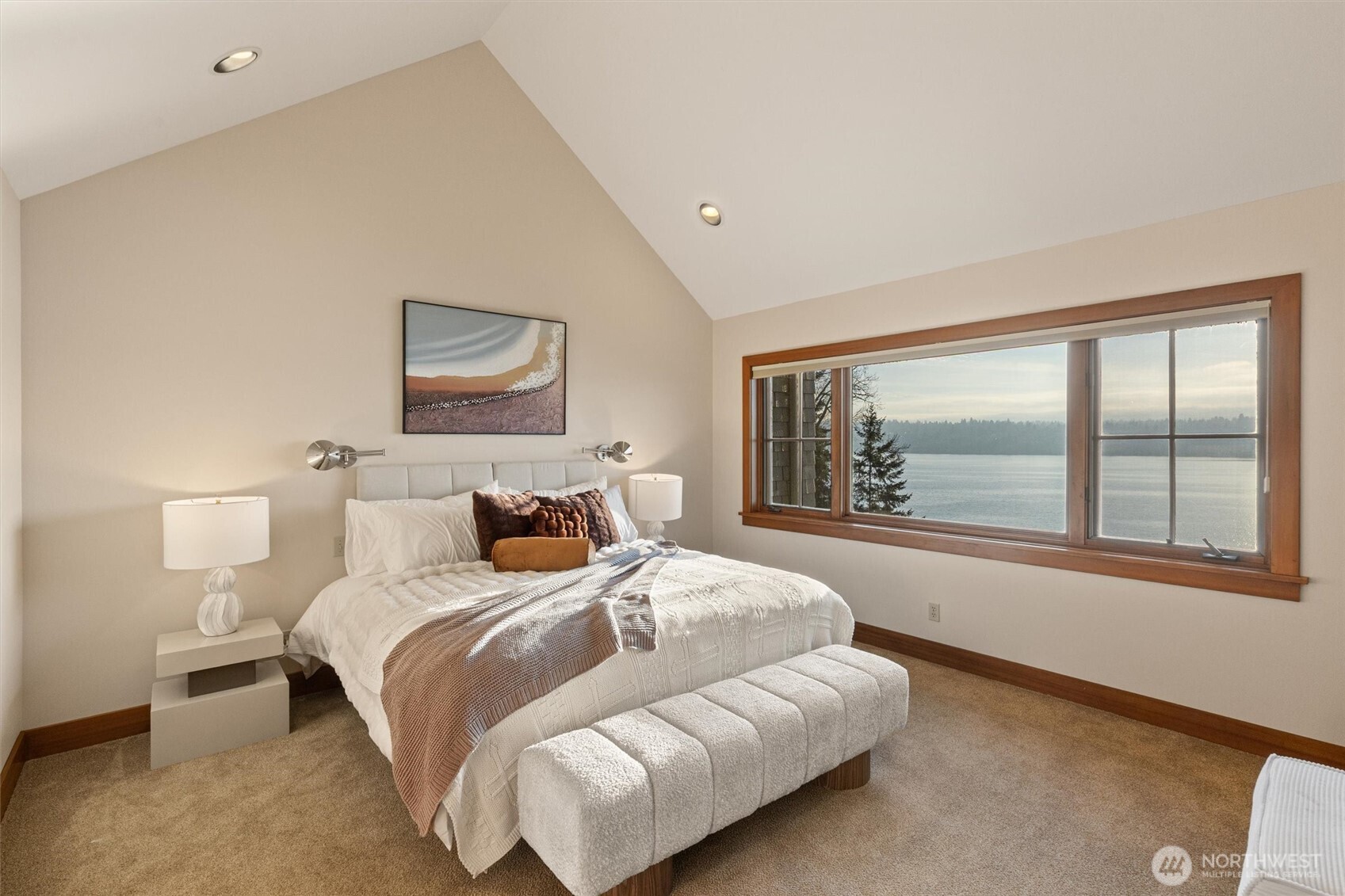 8281 West Mercer Way Mercer Island, WA 98040 - Photo 22 of 38 a bedroom with a large bed and a large window