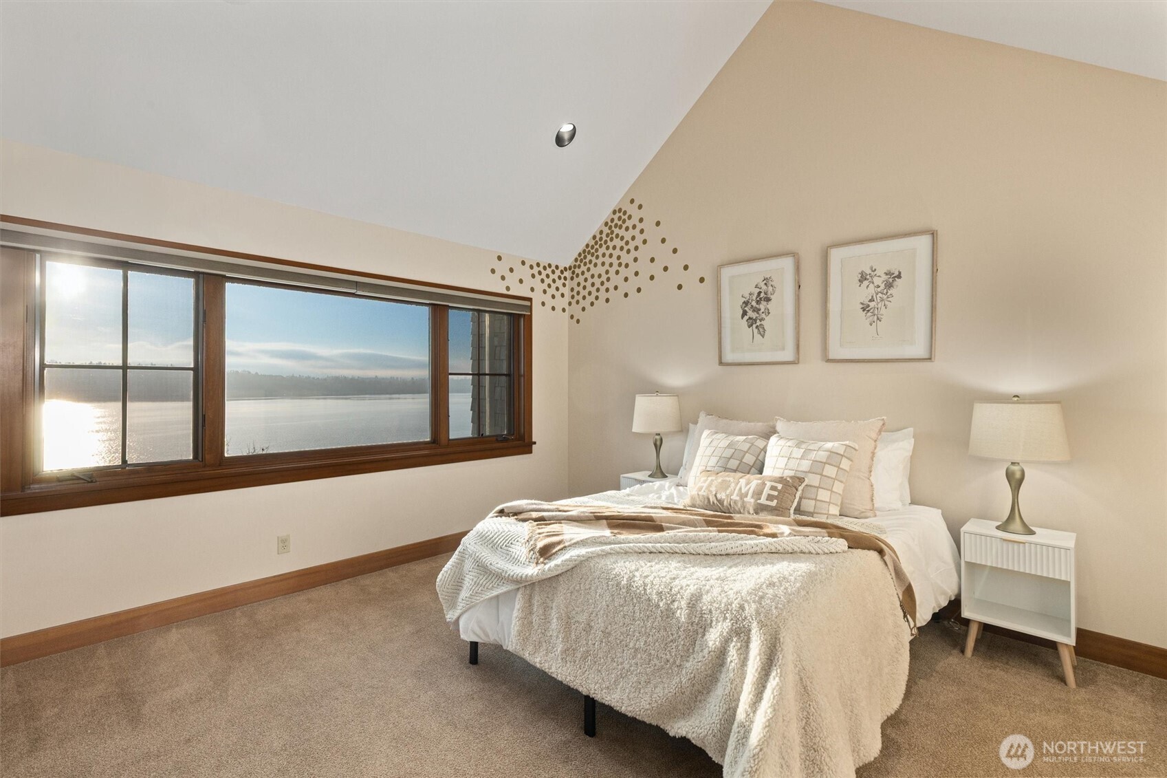 8281 West Mercer Way Mercer Island, WA 98040 - Photo 26 of 38 a bedroom with a bed and a large window