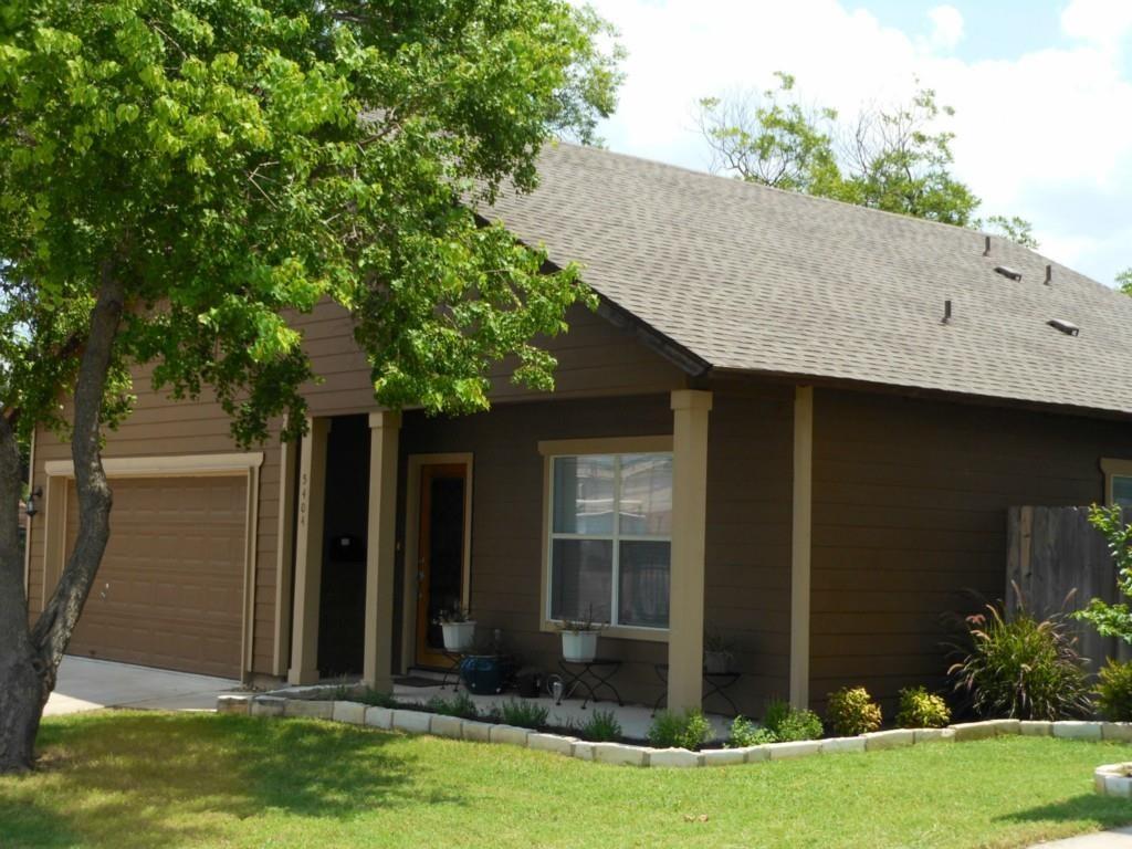 5404 Helen Street Austin, TX 78751 - Photo 2 of 7 View of front of home featuring a garage, a front lawn, and roof with shingles