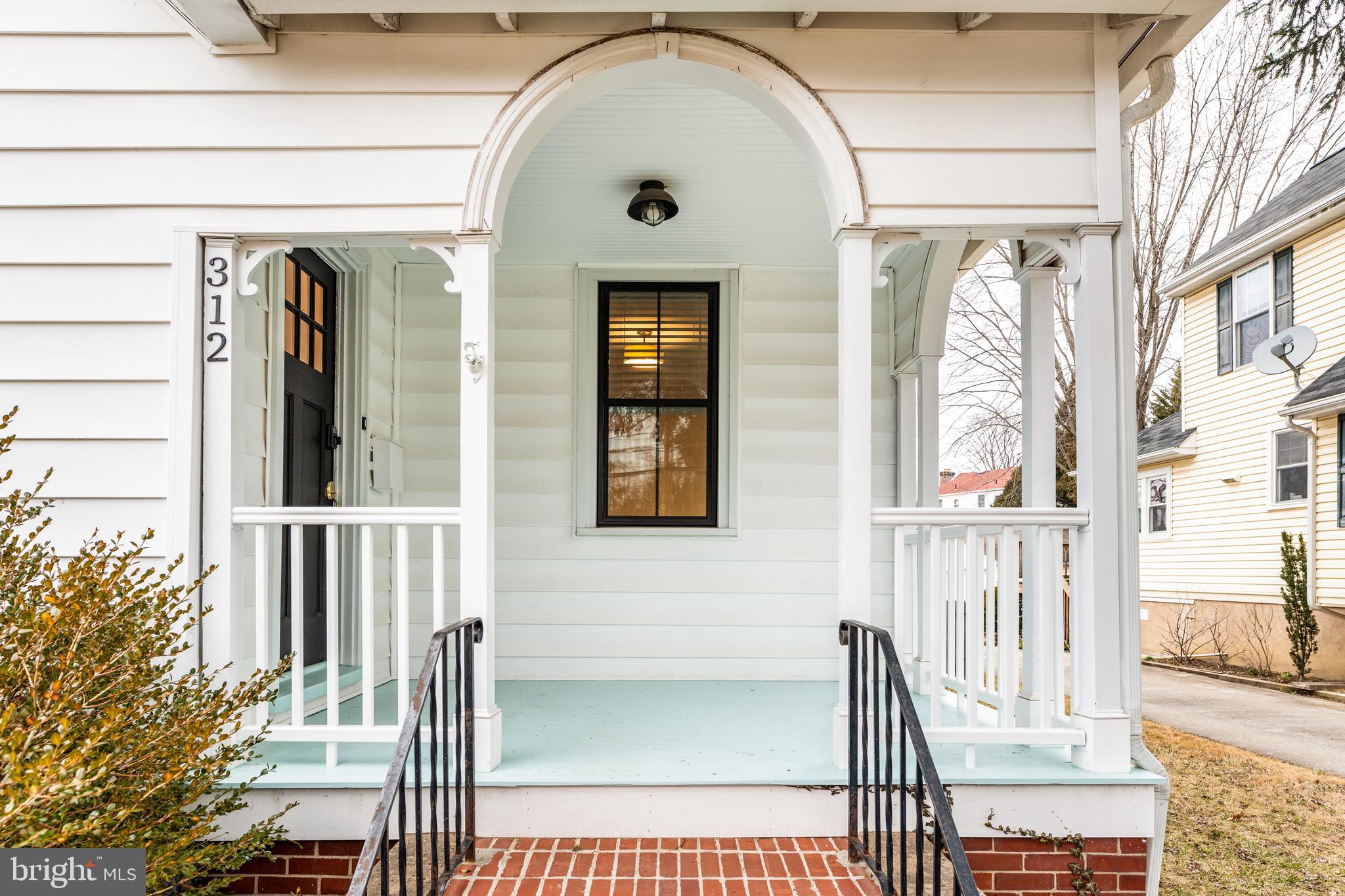 312 South Devon Avenue Wayne, PA 19087 - Photo 2 of 38 a view of a brick house with large windows