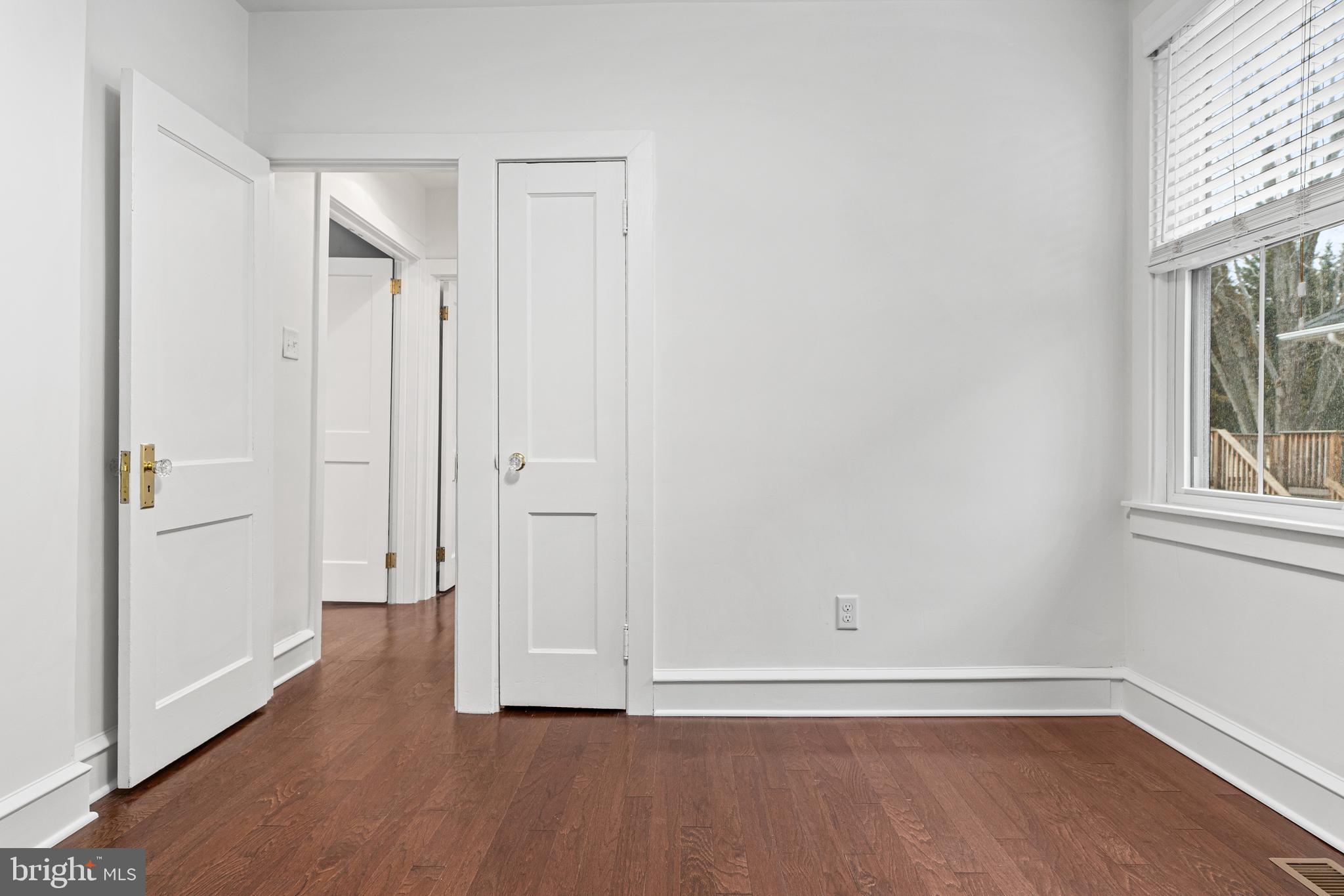 312 South Devon Avenue Wayne, PA 19087 - Photo 23 of 38 an empty room with wooden floor and windows
