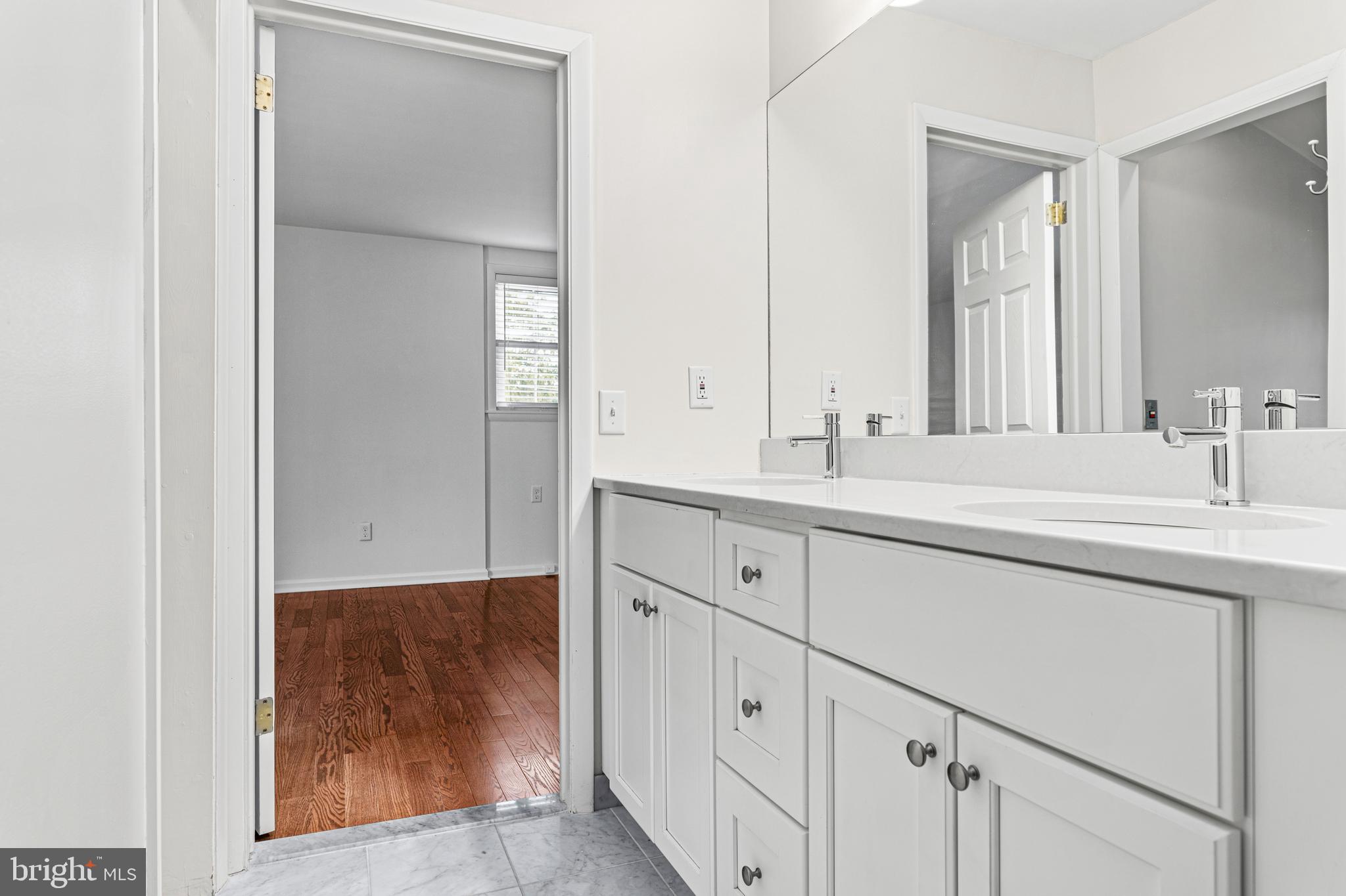 312 South Devon Avenue Wayne, PA 19087 - Photo 27 of 38 a bathroom with a sink and a mirror