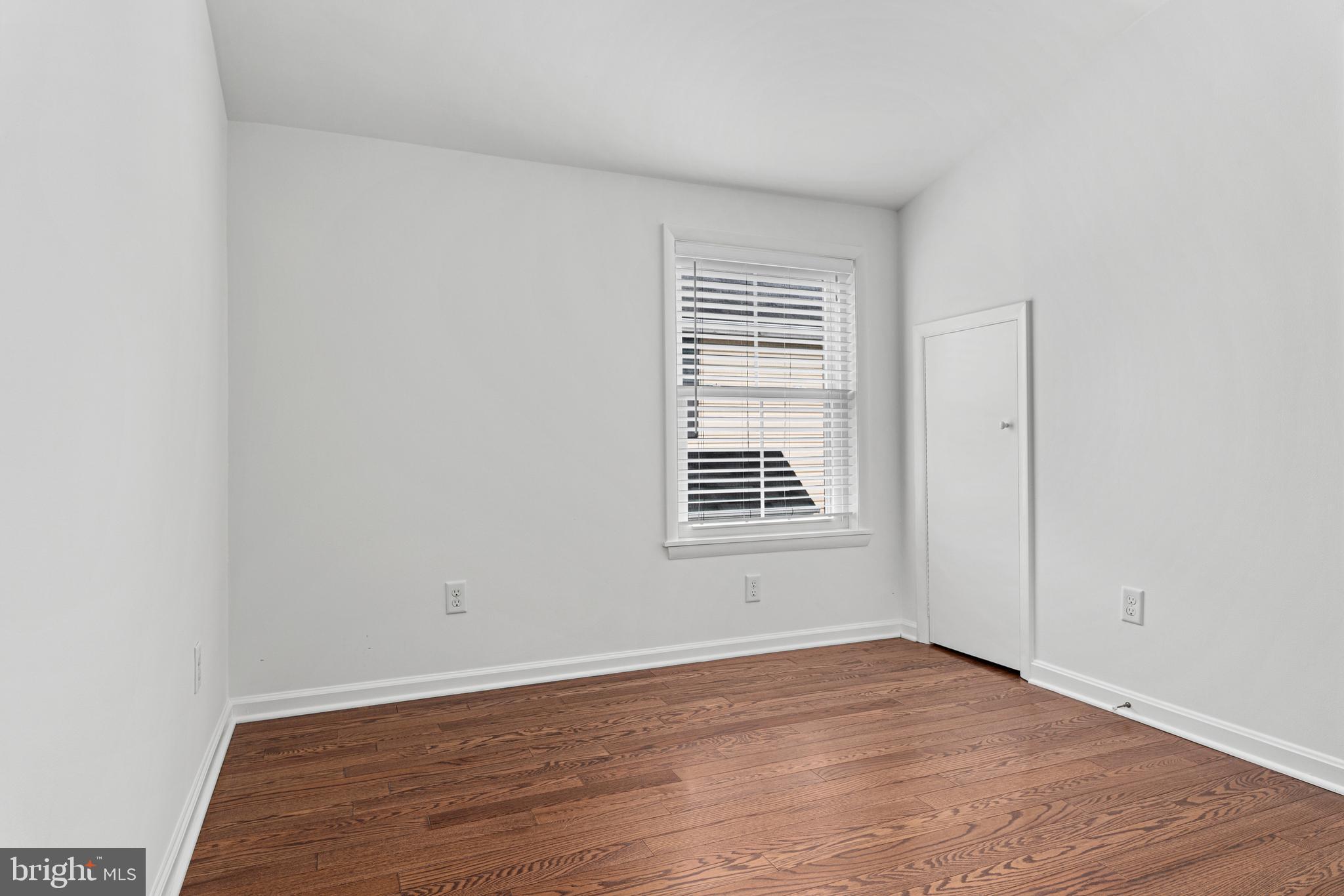 312 South Devon Avenue Wayne, PA 19087 - Photo 29 of 38 a view of an empty room with wooden floor and a window