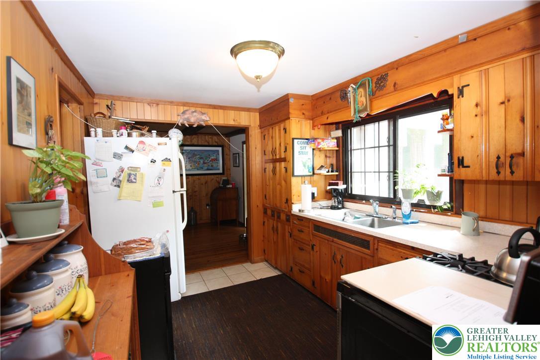 305 Cedar Hill Road Effort, PA 18330 - Photo 8 of 20 a kitchen with a sink appliances and cabinets