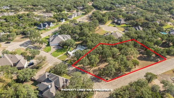 an aerial view of residential houses and trees