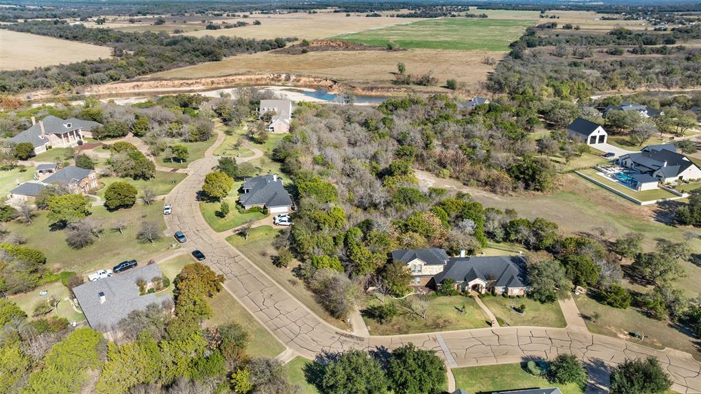 1240 Autumn Oaks Circle China Spring, TX 76633 - Photo 10 of 13 a view of a yard with a lake