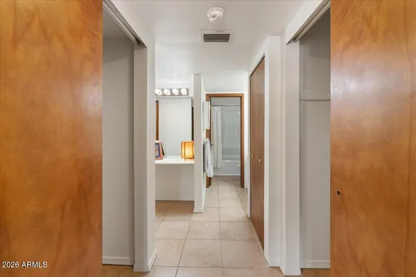 a view of a bathroom from a hallway