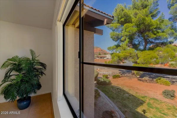 a view of a balcony with plants