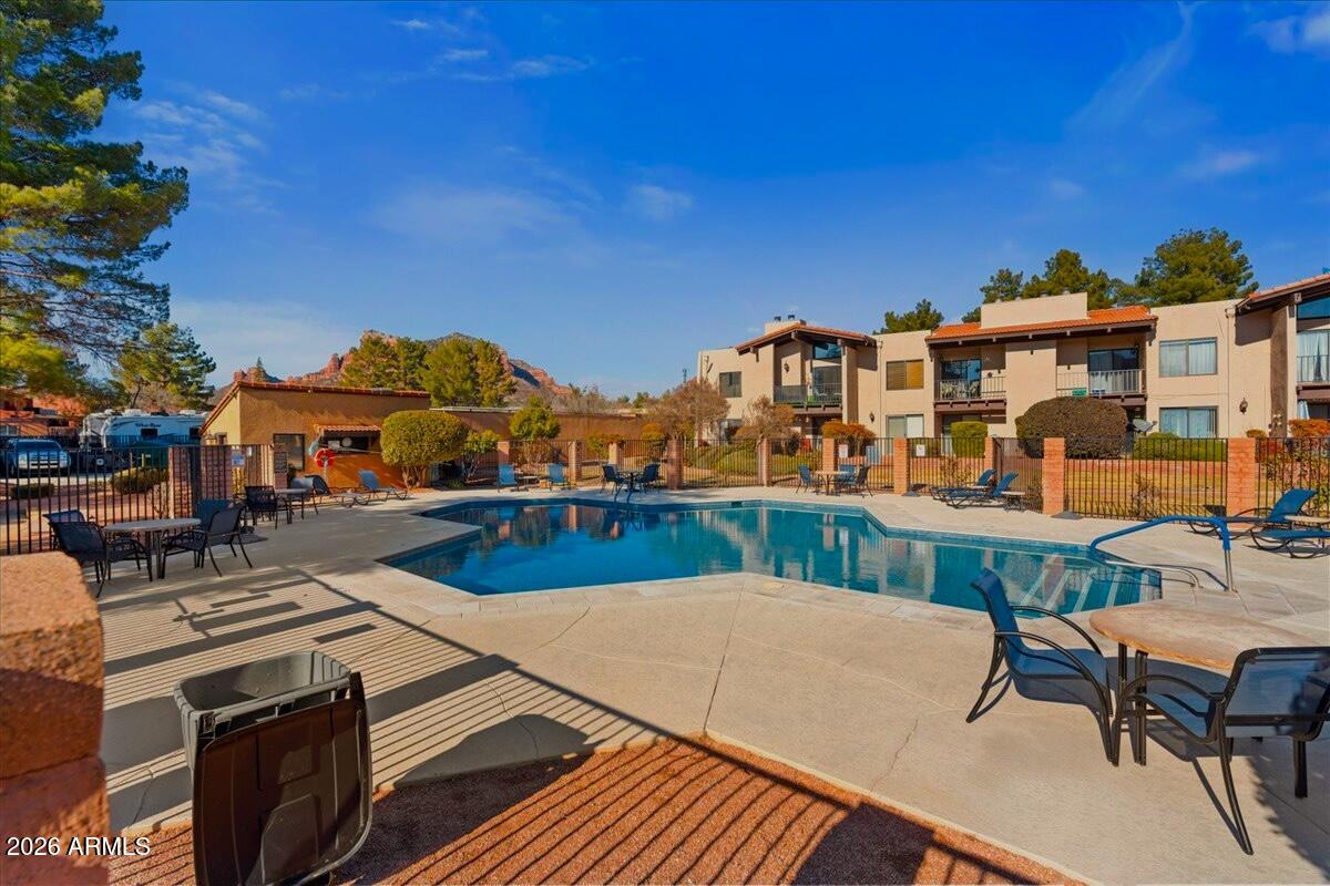 65 Verde Valley School Road, Unit H10 Sedona, AZ 86351 - Photo 19 of 20 a view of a balcony with two chairs and a table