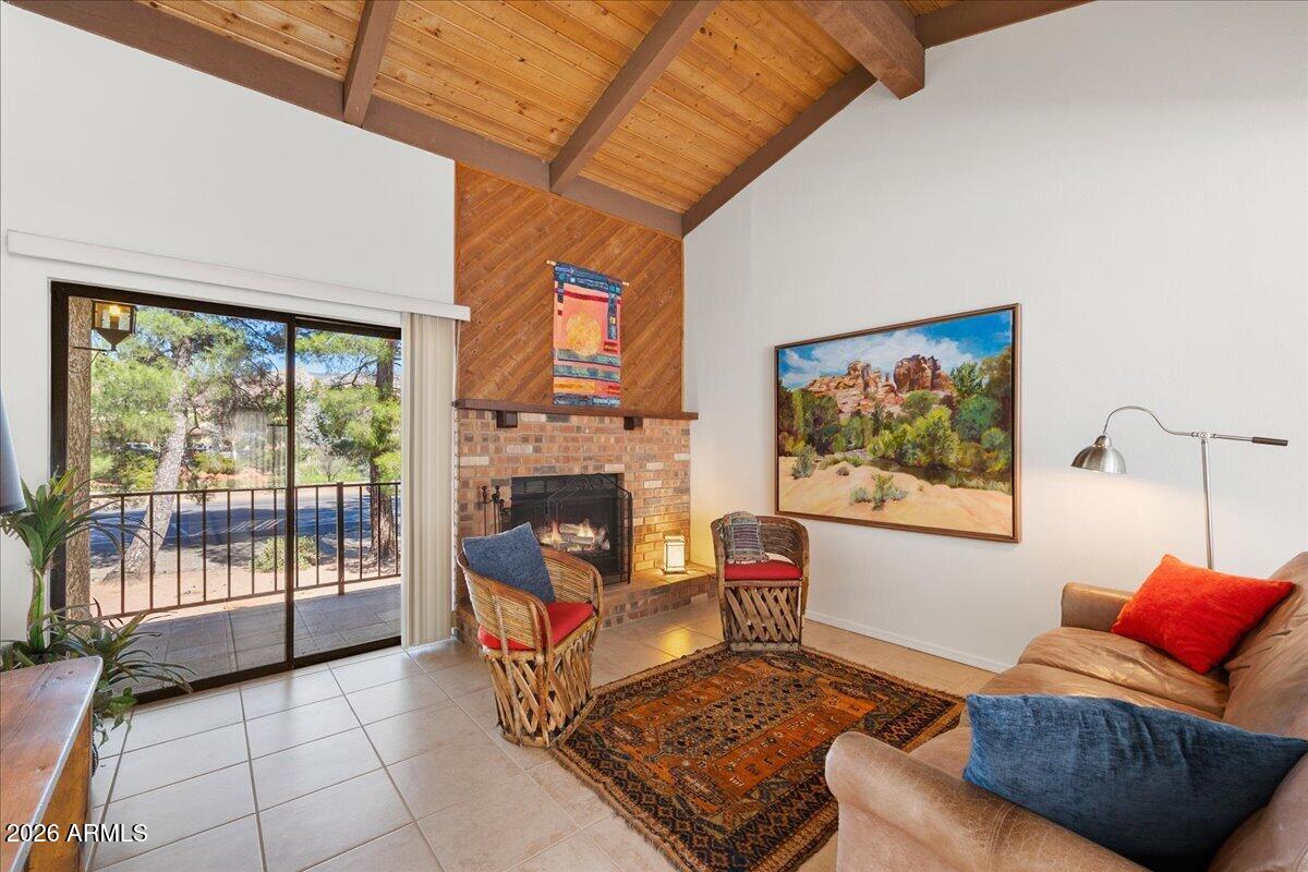 65 Verde Valley School Road, Unit H10 Sedona, AZ 86351 - Photo 4 of 20 a living room with furniture and a fireplace