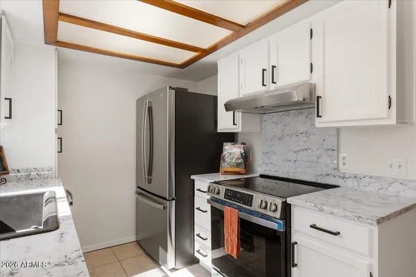 a kitchen with a stove microwave and refrigerator