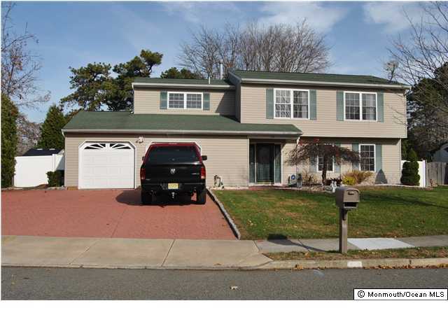 16 Hedgewood Road Howell, NJ 07731 - Photo 1 of 3 a house view with a garden space