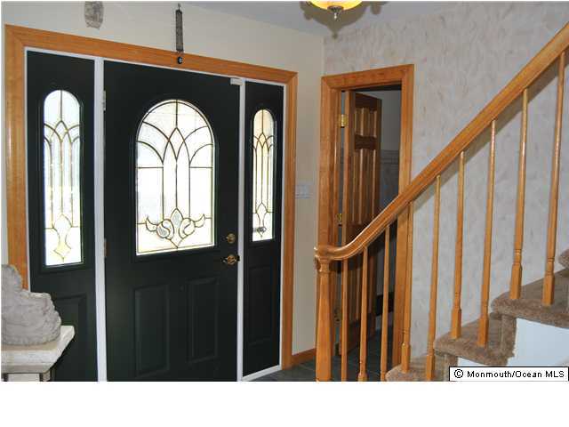 16 Hedgewood Road Howell, NJ 07731 - Photo 3 of 3 a view of a livingroom with wooden floor and stairs