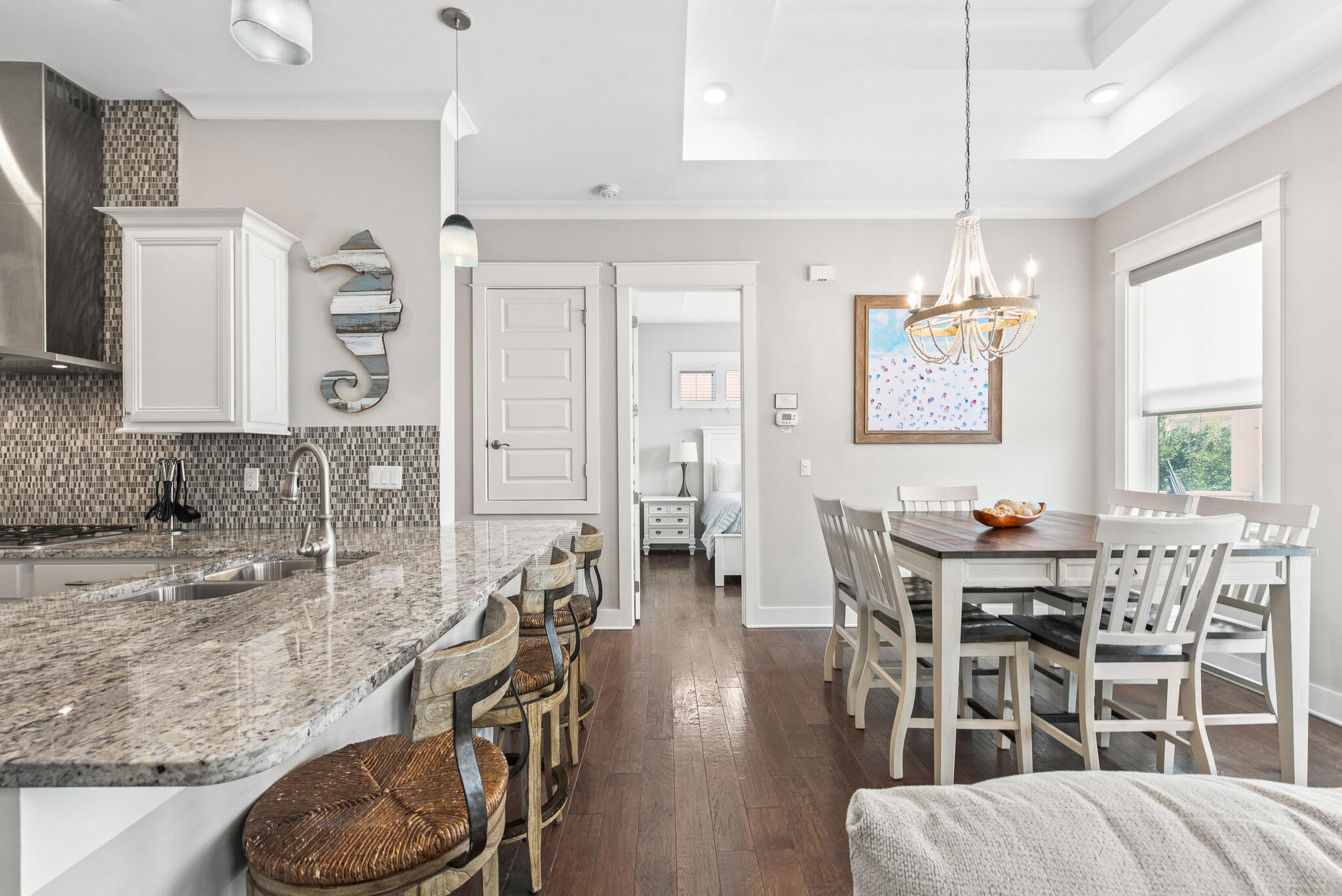 26 Milestone Dr Inlet Beach, Unit C Inlet Beach, FL 32461 - Photo 11 of 36 a view of a dining room with furniture and wooden floor