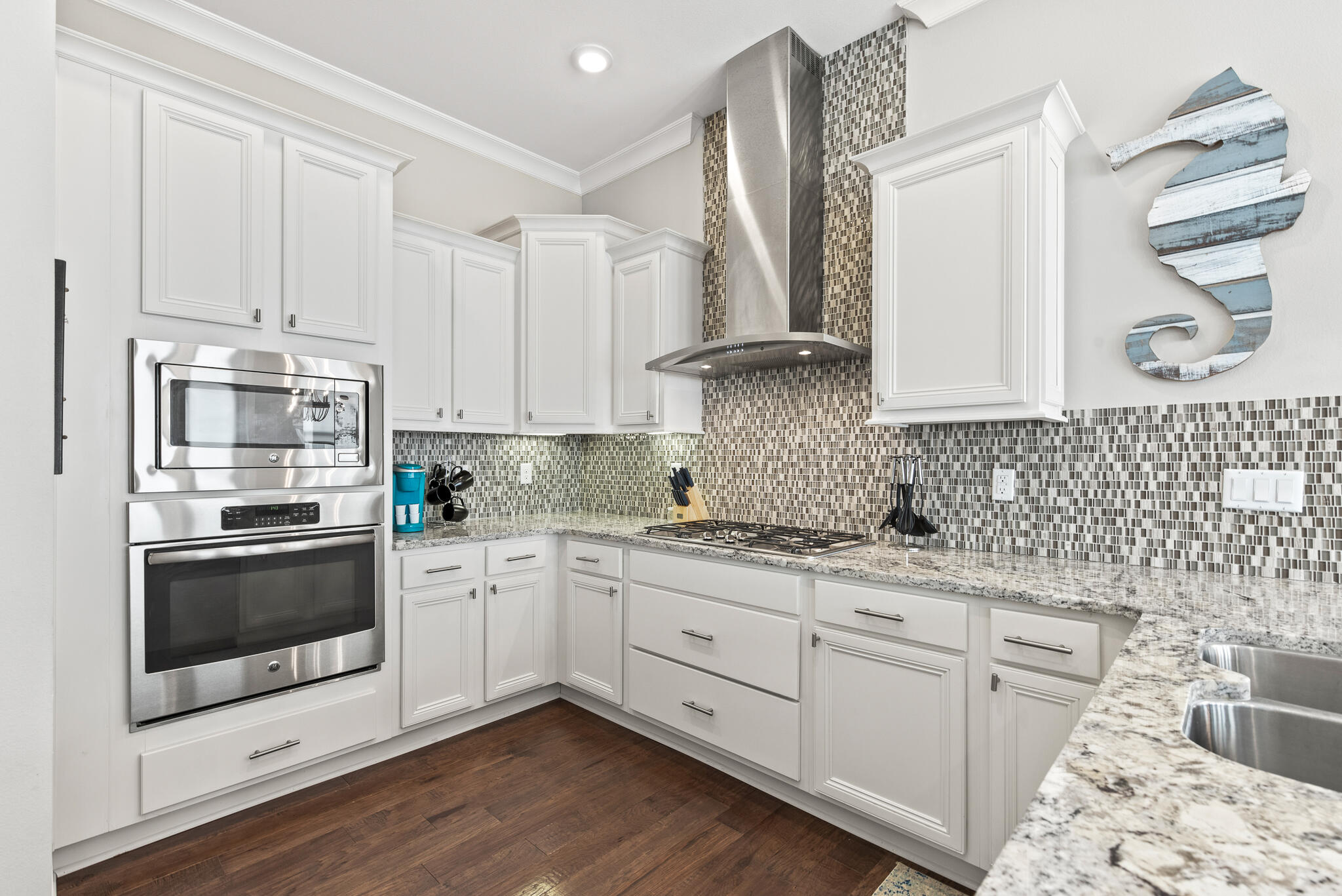 26 Milestone Dr Inlet Beach, Unit C Inlet Beach, FL 32461 - Photo 12 of 36 a kitchen with granite countertop white cabinets and white appliances