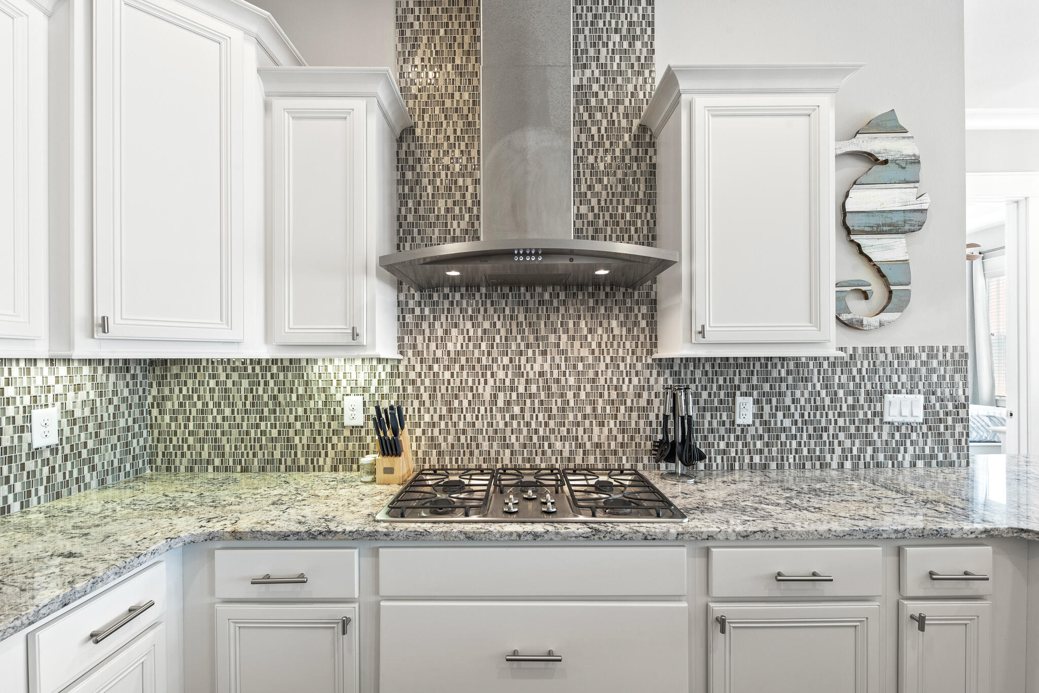 26 Milestone Dr Inlet Beach, Unit C Inlet Beach, FL 32461 - Photo 13 of 36 a kitchen with granite countertop white cabinets and a sink