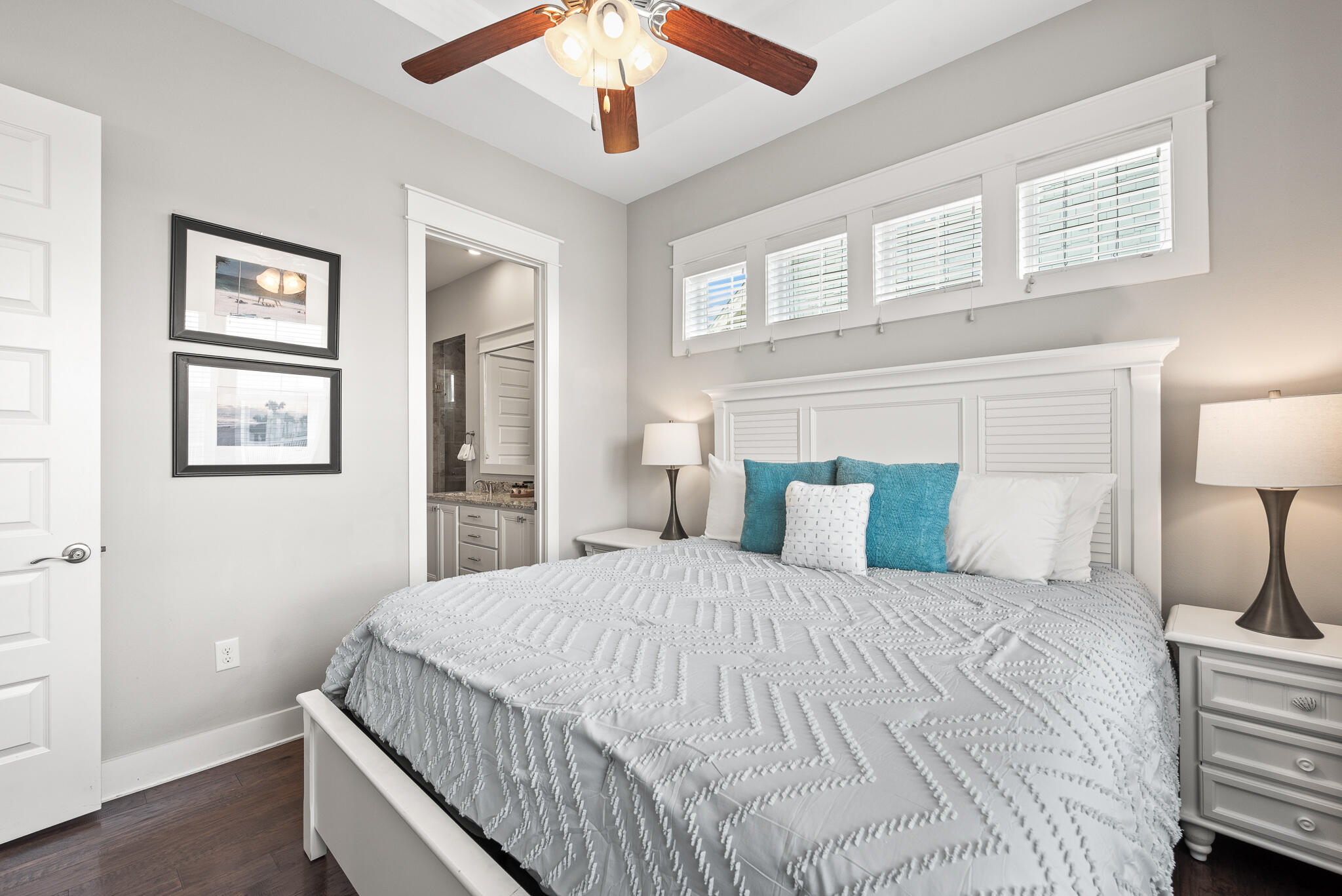 26 Milestone Dr Inlet Beach, Unit C Inlet Beach, FL 32461 - Photo 16 of 36 a bedroom with a large bed and a chandelier