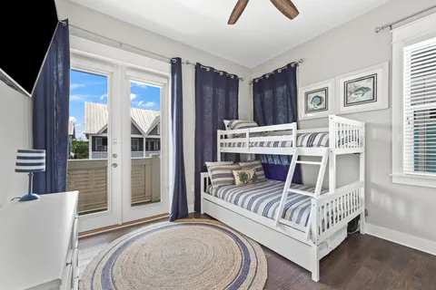a bedroom with a bed and a view of kitchen