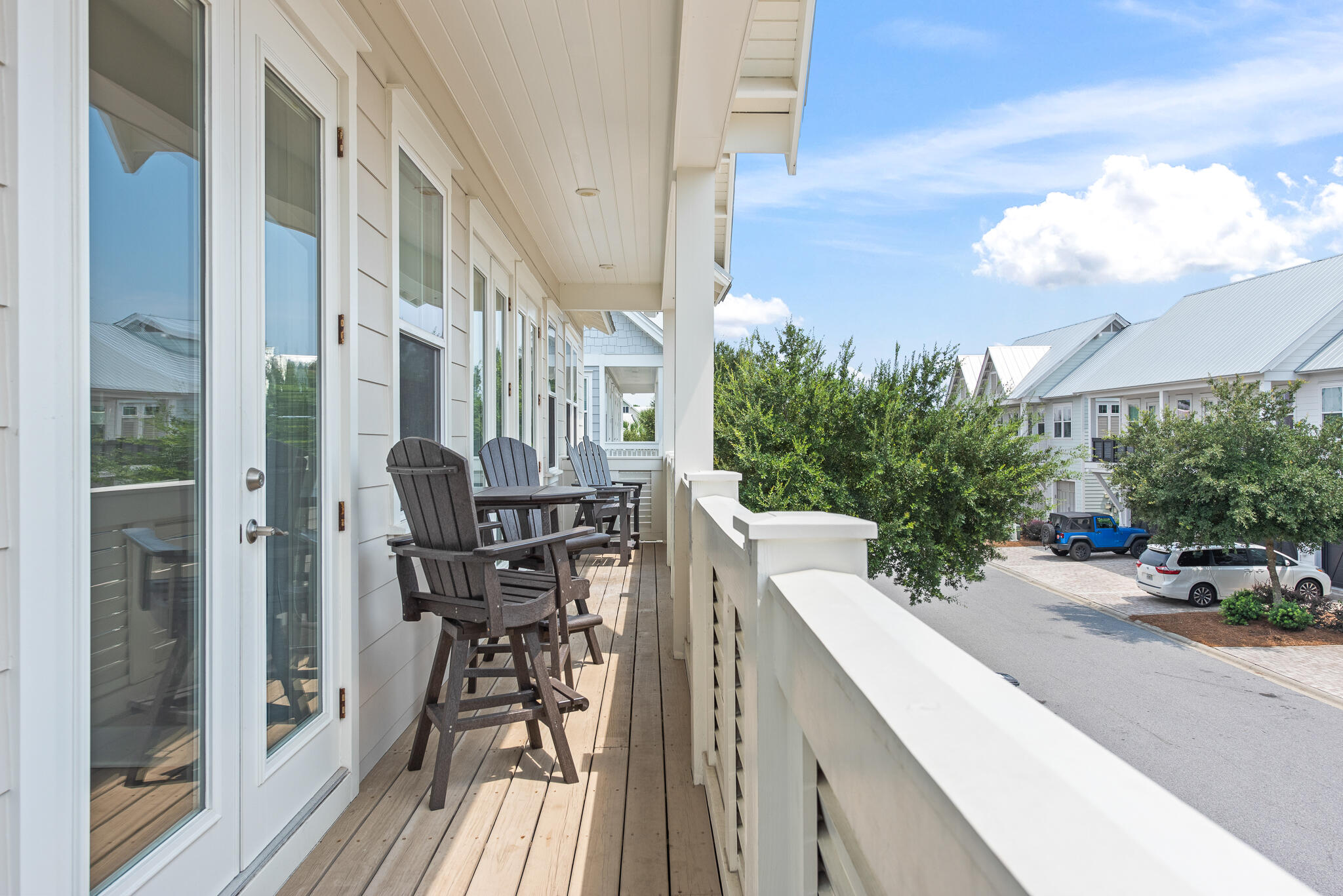 26 Milestone Dr Inlet Beach, Unit C Inlet Beach, FL 32461 - Photo 28 of 36 a view of a patio with table and chairs and potted plants