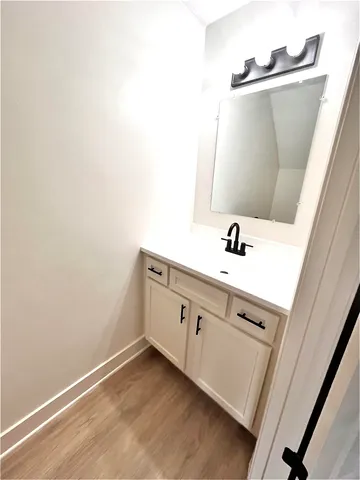 a bathroom with a sink and a mirror