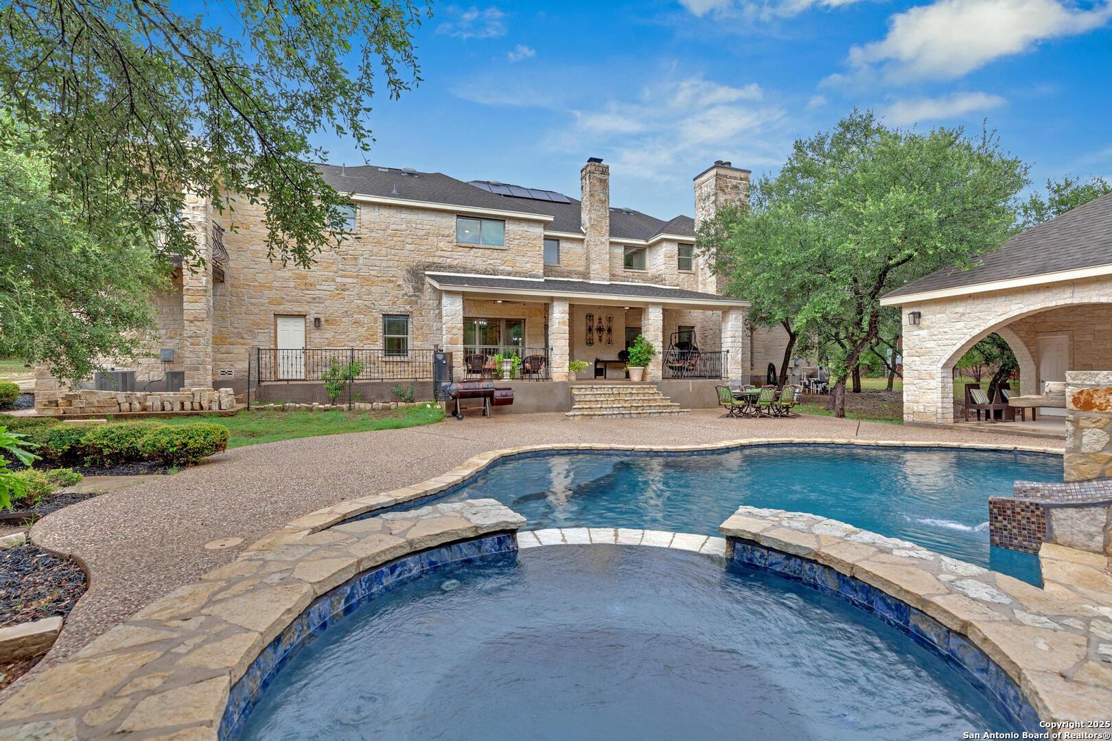 1130 Whispering Water Spring Branch, TX 78070 - Photo 1 of 43 a view of a house with a swimming pool