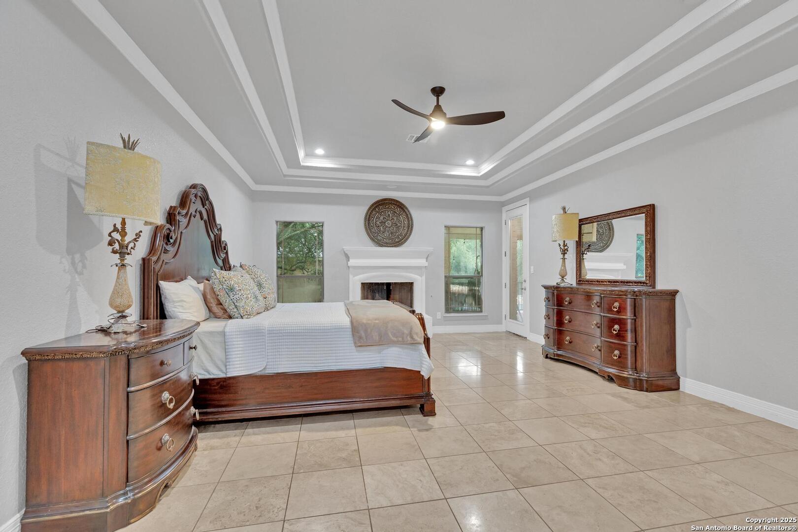 1130 Whispering Water Spring Branch, TX 78070 - Photo 11 of 43 a living room with furniture a clock and a fireplace