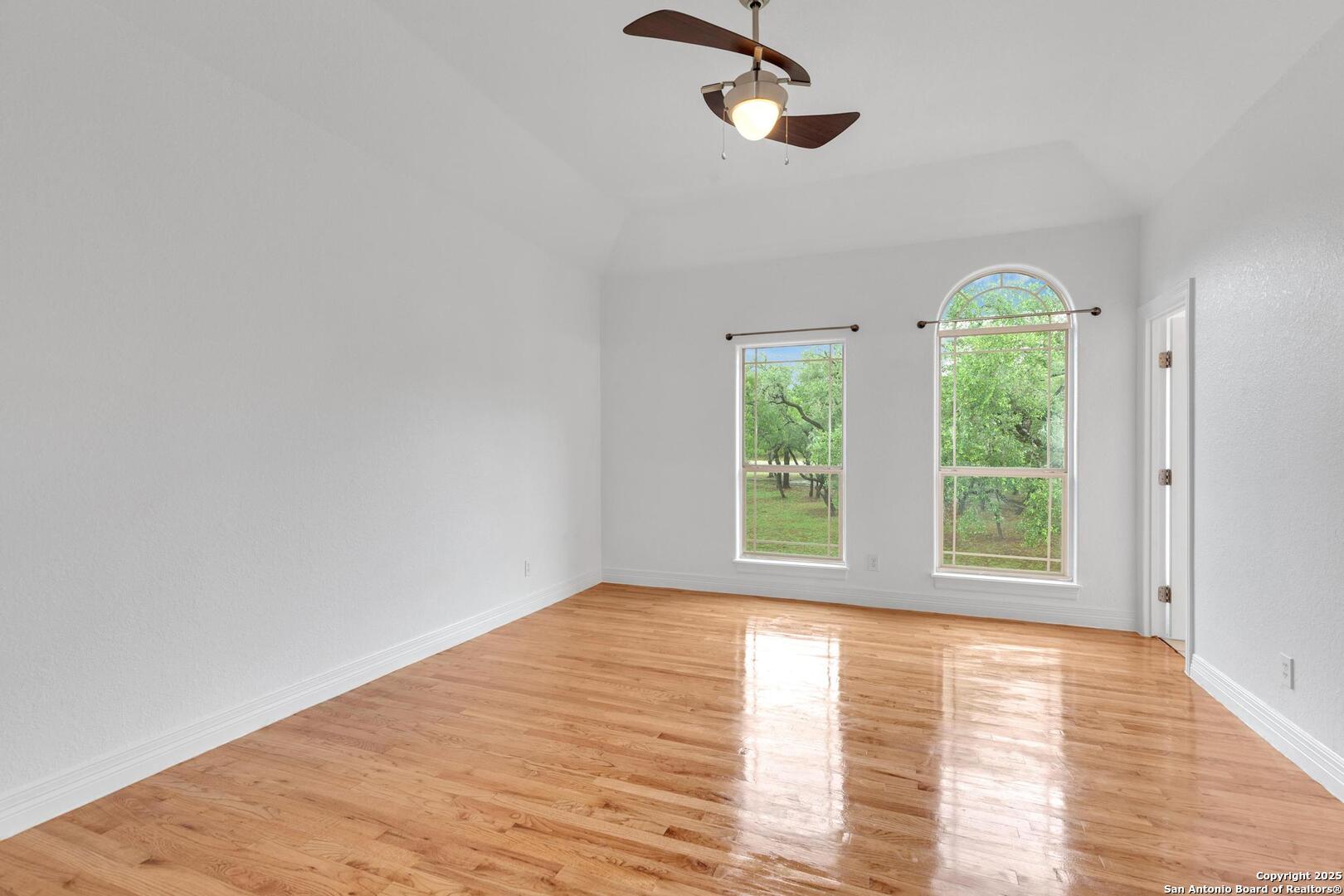 1130 Whispering Water Spring Branch, TX 78070 - Photo 17 of 43 a view of empty room with wooden floor and window