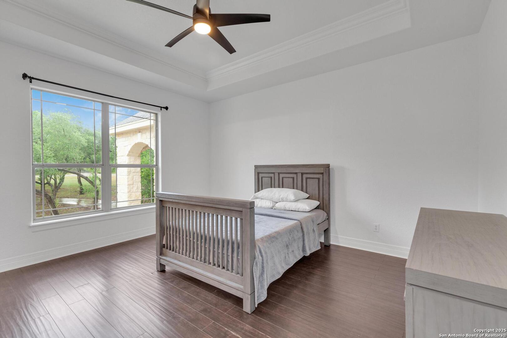 1130 Whispering Water Spring Branch, TX 78070 - Photo 18 of 43 a room with a bed and window