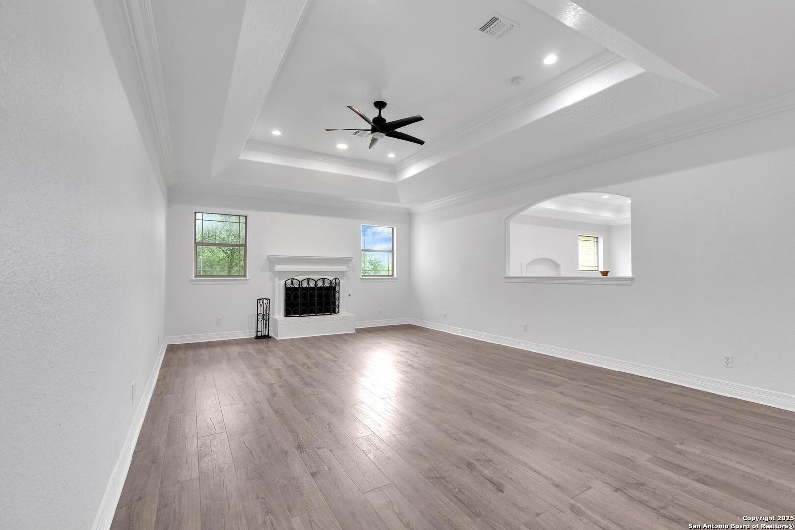 1130 Whispering Water Spring Branch, TX 78070 - Photo 21 of 43 an empty room with windows and fireplace