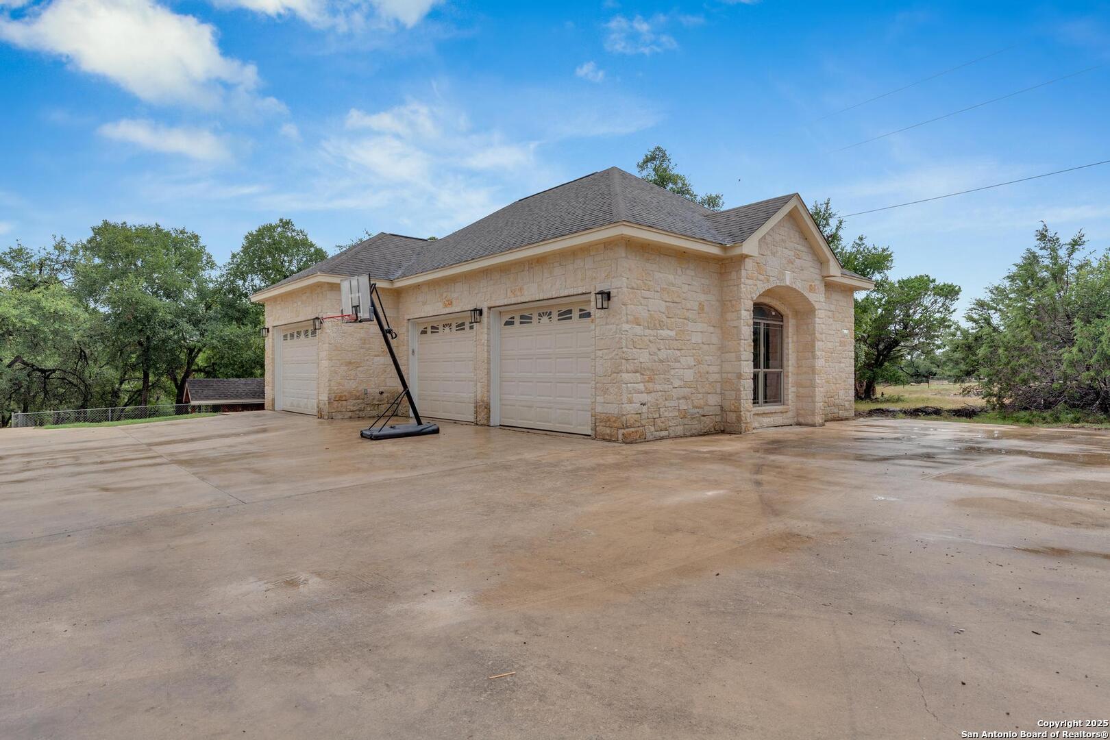 1130 Whispering Water Spring Branch, TX 78070 - Photo 28 of 43 a view of a house with a yard
