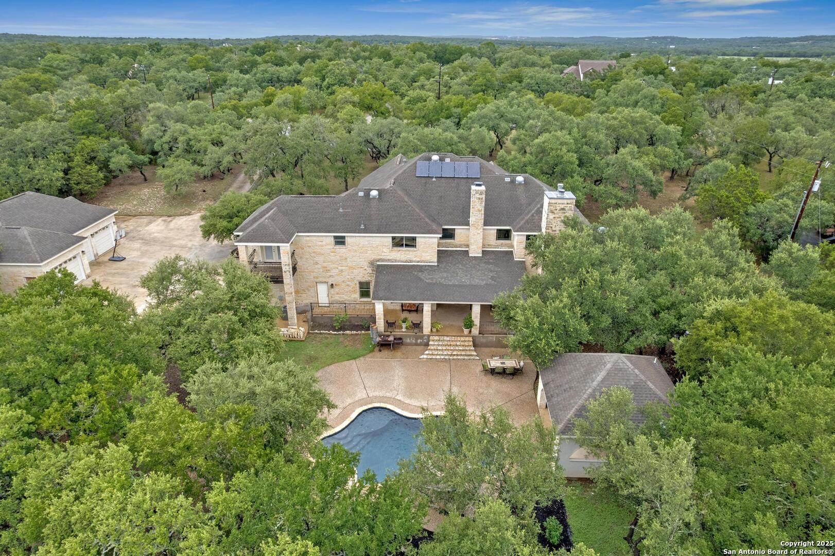 1130 Whispering Water Spring Branch, TX 78070 - Photo 30 of 43 an aerial view of a house with swimming pool garden and patio