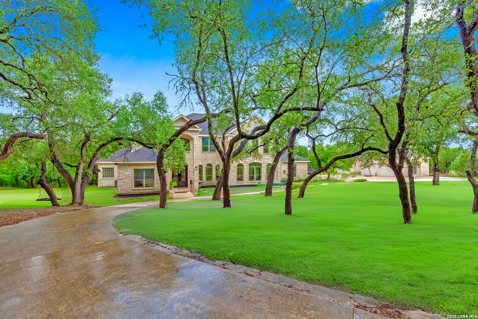 1130 Whispering Water Spring Branch, TX 78070 - Photo 38 of 43 a view of white house with a big yard and large trees
