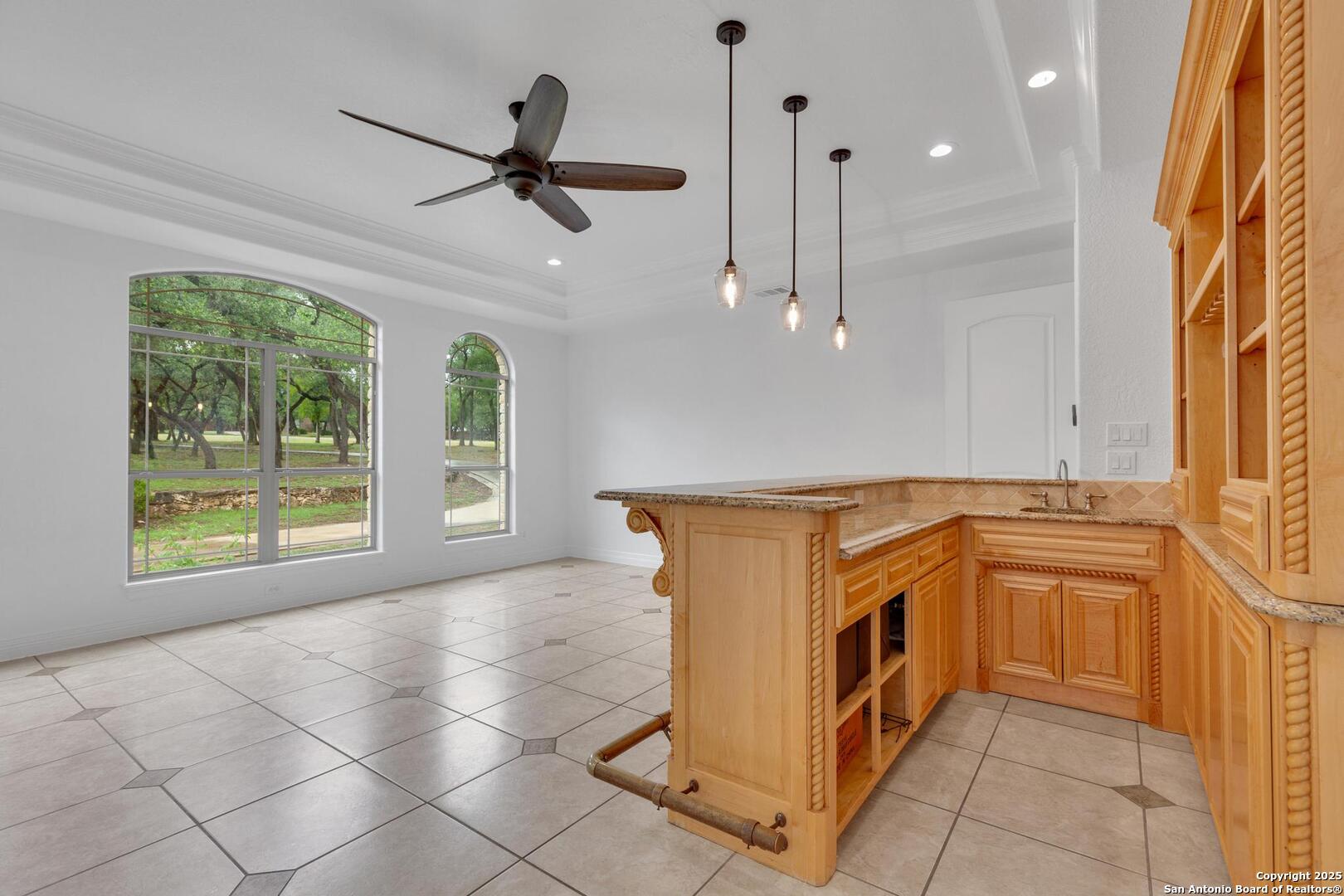 1130 Whispering Water Spring Branch, TX 78070 - Photo 10 of 43 a kitchen with stainless steel appliances granite countertop a stove a sink and a refrigerator