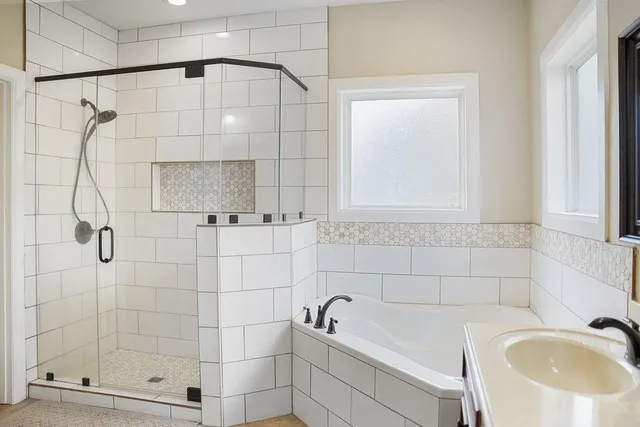 a bedroom with a bed and chandelier