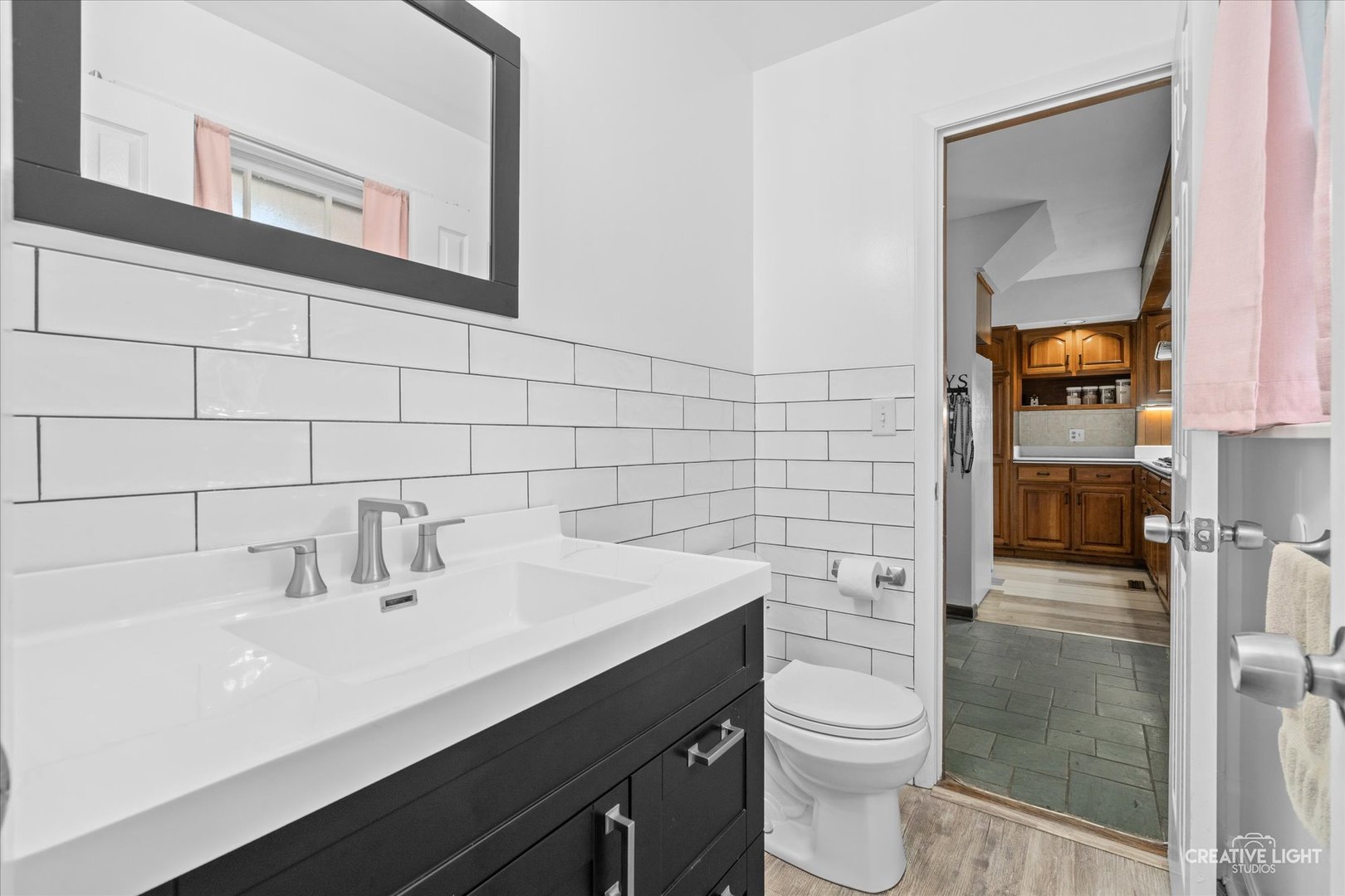 1800 East Algonquin Road Des Plaines, IL 60016 - Photo 15 of 26 a bathroom with a sink a toilet and shower