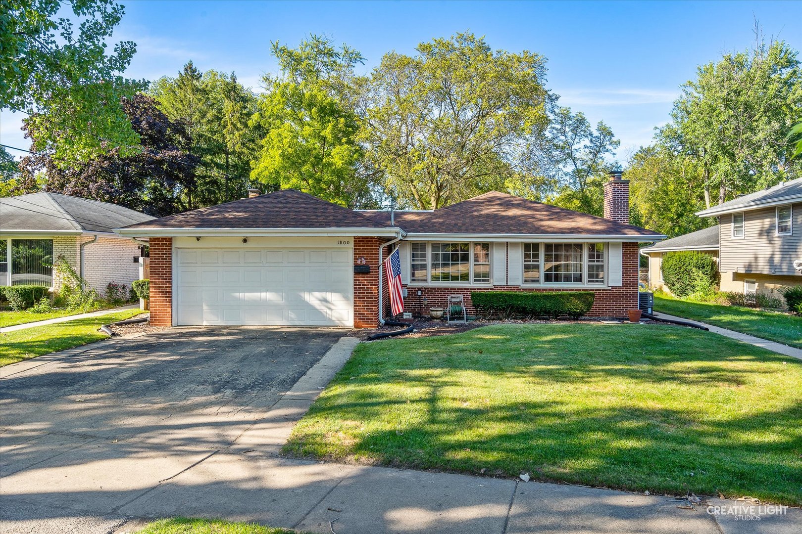 1800 East Algonquin Road Des Plaines, IL 60016 - Photo 2 of 26 a view of a house with a yard