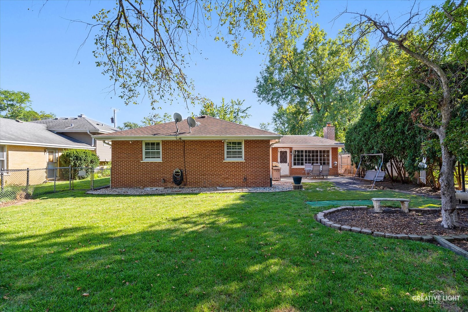 1800 East Algonquin Road Des Plaines, IL 60016 - Photo 25 of 26 a front view of a house with a garden