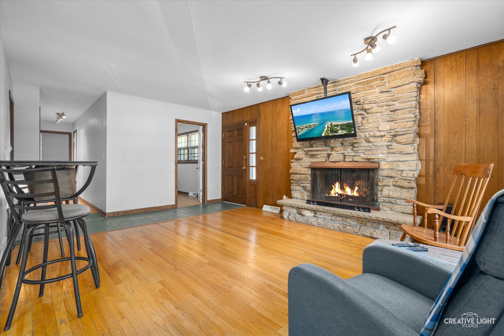 1800 East Algonquin Road Des Plaines, IL 60016 - Photo 3 of 26 a living room with furniture and a fireplace