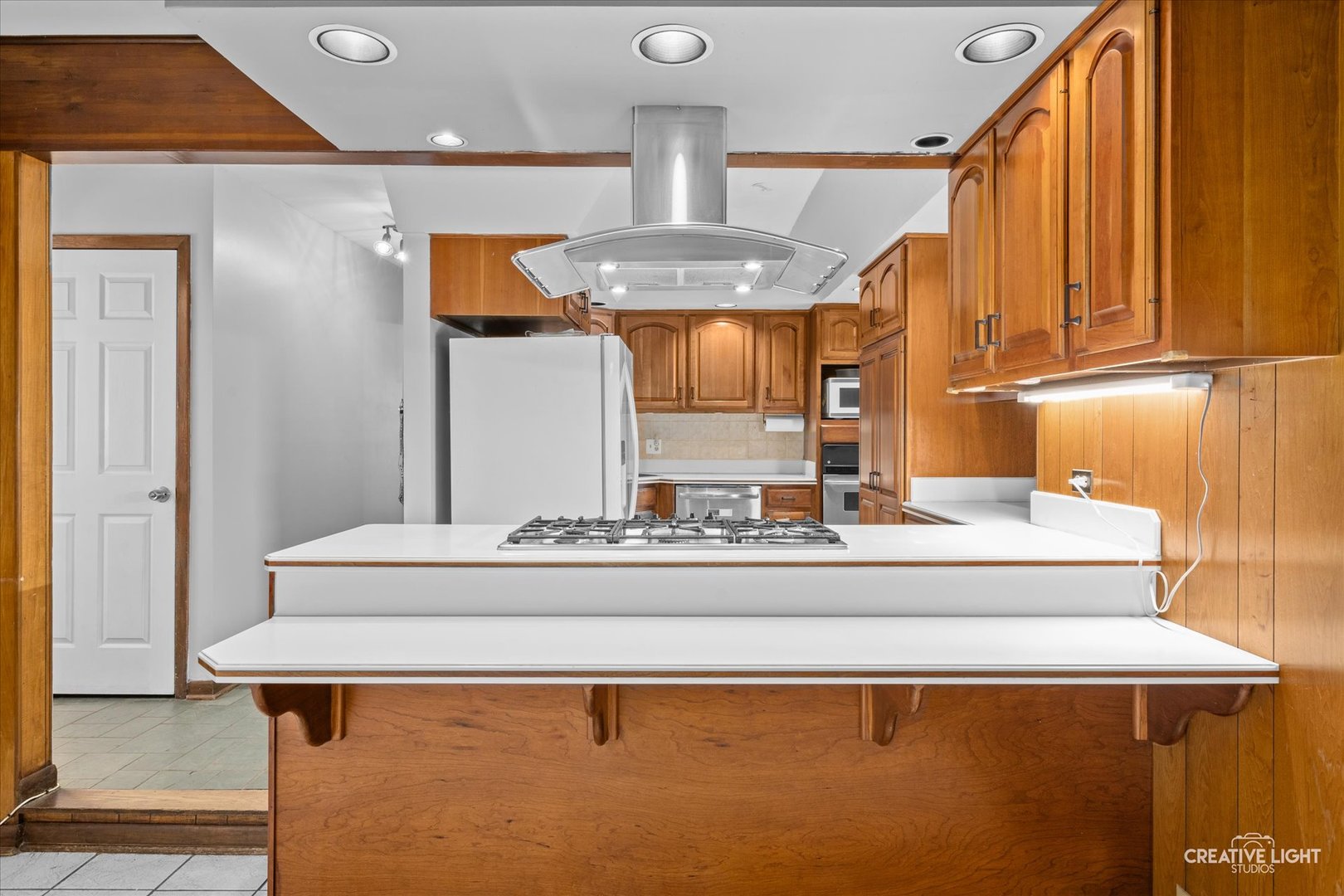 1800 East Algonquin Road Des Plaines, IL 60016 - Photo 7 of 26 a view of living room with furniture and a chandelier