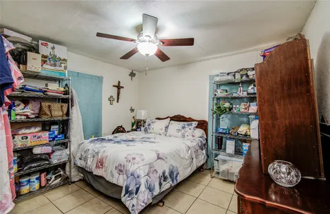 a bedroom with a bed and a bookshelf