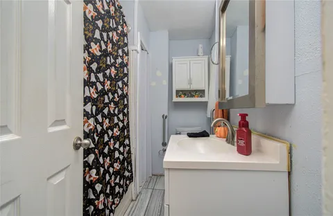 a kitchen with a sink and cabinets