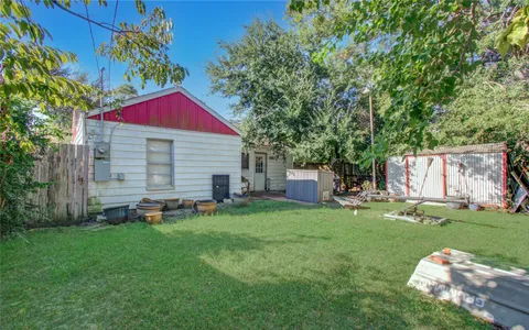 a view of a house with a yard porch and sitting area