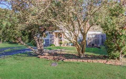 a backyard of a house with lots of green space