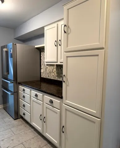 a view of cabinets with wooden floor
