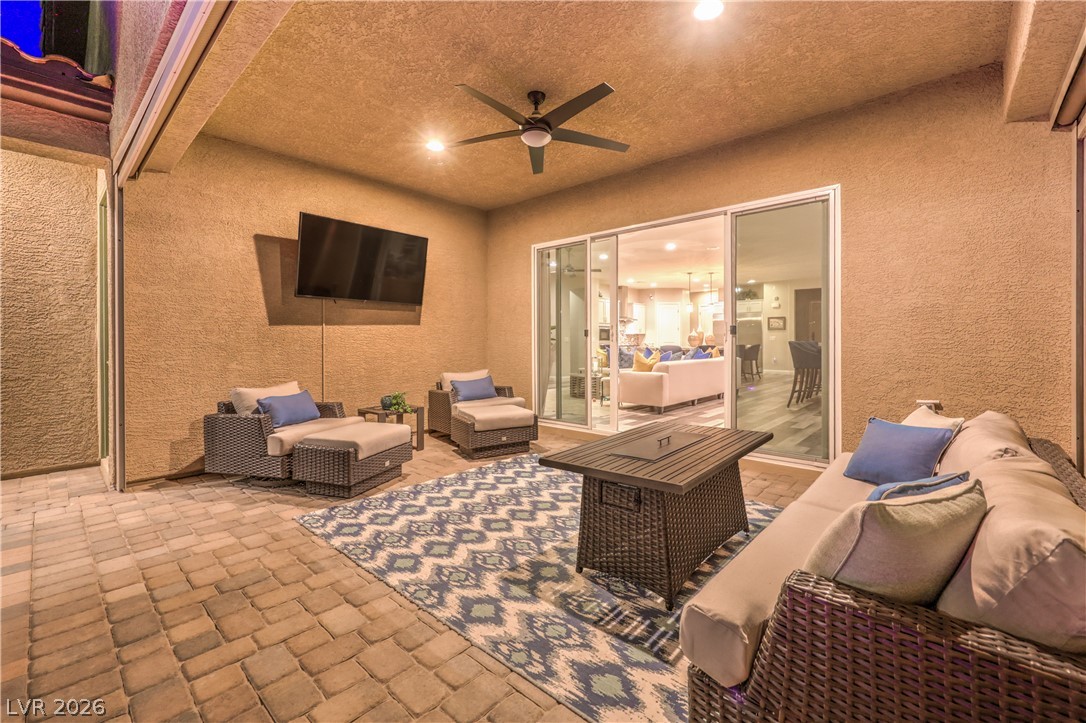 7119 Arabian Ridge Street Las Vegas, NV 89131 - Photo 51 of 73 An inviting outdoor living area, perfect for entertaining, with direct access to interior spaces.