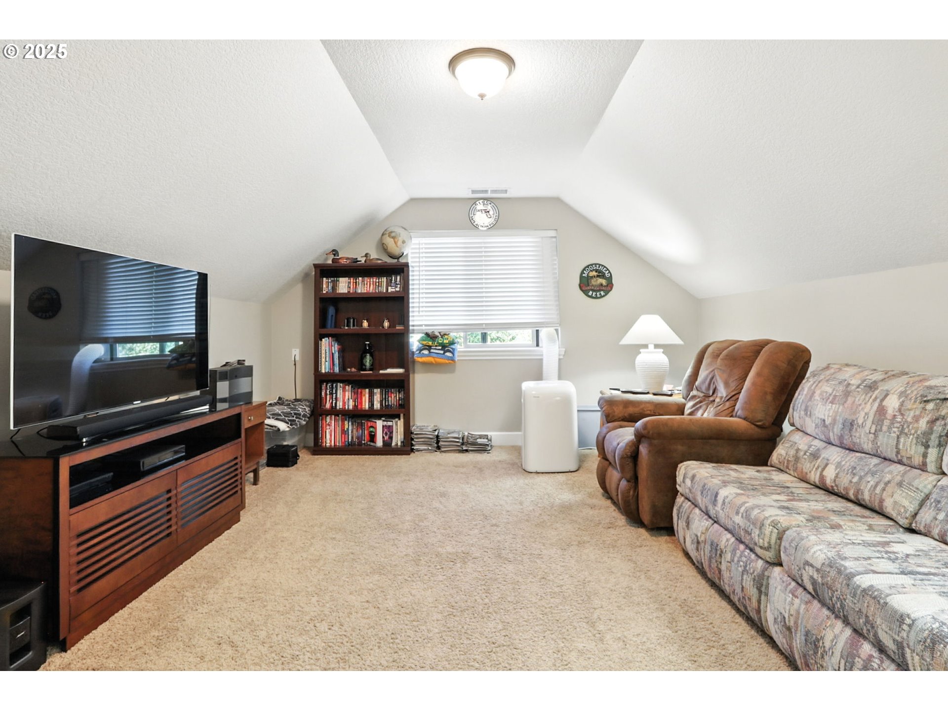 207 Finneys Avenue Molalla, OR 97038 - Photo 17 of 24 a living room with furniture and a flat screen tv