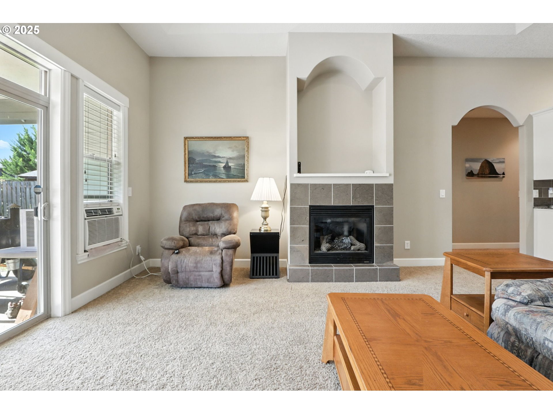 207 Finneys Avenue Molalla, OR 97038 - Photo 10 of 24 a living room with furniture and a fireplace