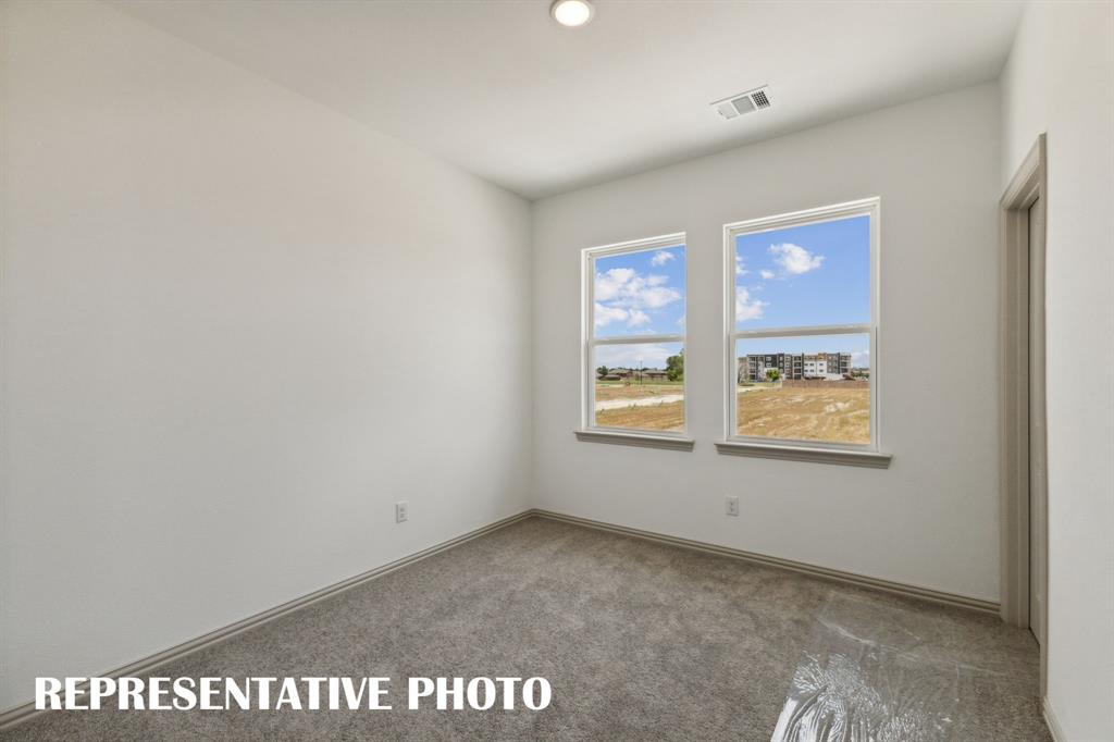 1009 Splitrock Drive Allen, TX 75013 - Photo 15 of 20 an empty room with windows