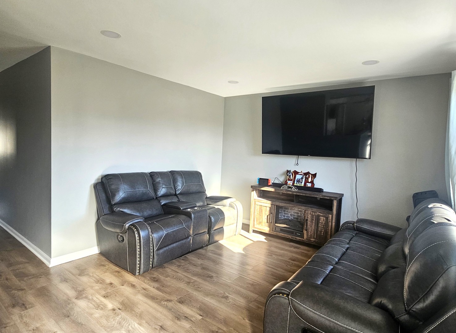 1353 Spring Valley Drive Carol Stream, IL 60188 - Photo 11 of 25 a living room with furniture and a flat screen tv